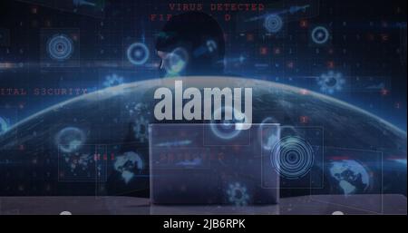 Image of cyber attack warning and scopes scanning over hacker using laptop Stock Photo