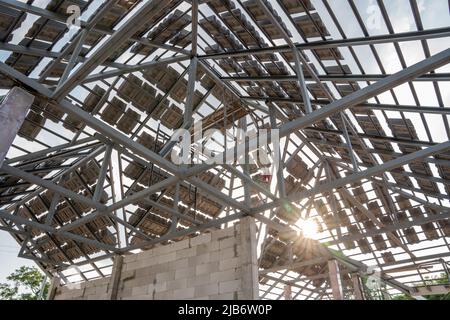 During the preparation before roofing of concrete or CPAC cement roof tiles on the new roof is under construction. residential building. Infrastructur Stock Photo