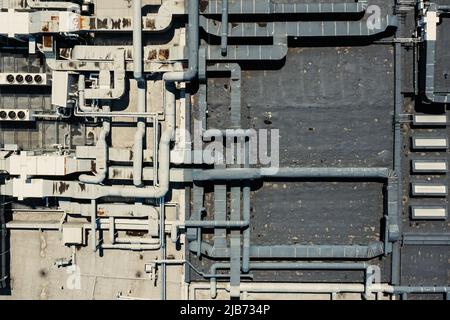 Air Condition Ventilation System on the Building Roof. Industrial Air system of ventilation and Air conditioning. Aerial Shot. Stock Photo