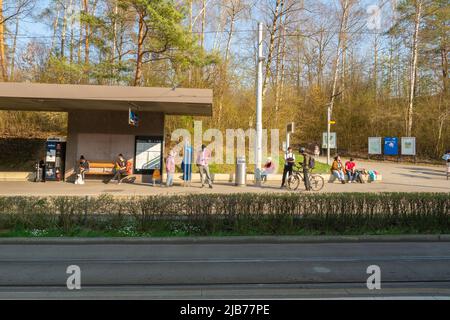 Zurich, Switzerland - March 26th 2022: People waiting at the tram stop Milchbuck Stock Photo