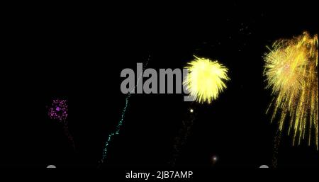 Image of colourful christmas and new year fireworks exploding in night sky Stock Photo