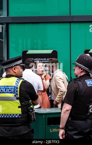 Epson Surrey, London UK, June 03 2022, Police Officers And Genral Public Outside Epsom Railway Station Stock Photo