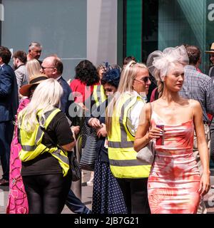 Epson Surrey, London UK, June 03 2022, Crowds Of Fashionable Dressed Racegoers Outside Epsom Railway Station For The Epsom Classic Derby Horse Race Stock Photo