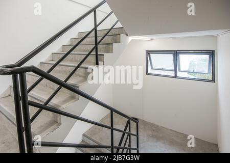 Stairwell and emergency exit in building Stock Photo
