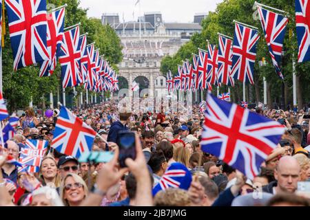 London, UK. 2nd June, 2022. The Mall in Central London is a sea of Red, White and Blue as people enjoy celebrating Queen Elizabeth's 70 years on the throne. The Jubilee celebrations will run from June2-5th. Credit: Karl Black/Alamy Live News Stock Photo