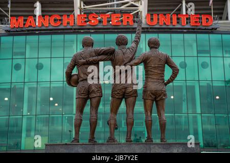 Manchester, England, March 27, 2019. the holy trinity of Charlton, Law and Best players at Old Trafford, the city's football stadium.