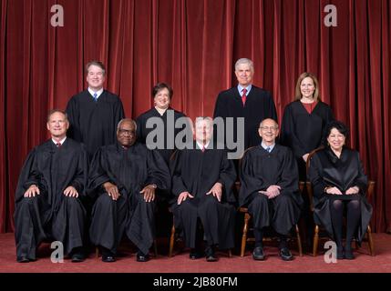 Official group portrait of all U.S. Supreme Court Justices on April 23, 2021.  Front row, left to right — Associate Justice Samuel A. Alito, Associate Justice Clarence Thomas, Chief Justice John G. Roberts, Jr., Associate Justice Stephen G. Breyer, Associate Justice Sonia Sotomayor.  Back row — Associate Justice Brett M. Kavanaugh, Associate Justice Elena Kagan, Associate Justice Neil M. Gorsuch, Associate Justice Amy Coney Barrett.  (Photo by Fred Schilling / Collection of the Supreme Court of the United States) Stock Photo