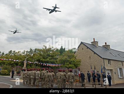 Two C-130J Super Hercules aircraft out of Ramstein Air Base, Germany, fly over Negreville, France during a D-Day ceremony June 3, 2022. On June 6, 1944 a Douglas C-47 Skytrain aircraft crashed near Negreville after being hit by anti-aircraft fire and all aircrew members and paratroopers were forced to jump 12 miles away from their intended drop zone. (U.S. Air Force photo by Senior Airman Thomas Karol) Stock Photo