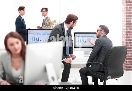caucasian business people talking having a discussion conversation in office. Stock Photo