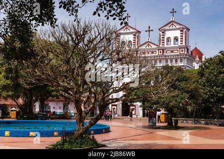 Guatape, Antioquia - Colombia - May 25, 2022. Church of Our Lady of Carmen, built in 1865 is Greco-Roman. Stock Photo