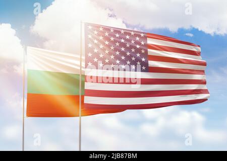 Sunny blue sky and flags of united states of america and bulgaria Stock Photo