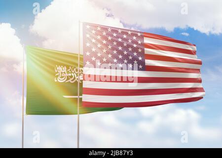 Sunny blue sky and flags of united states of america and saudi arabia Stock Photo