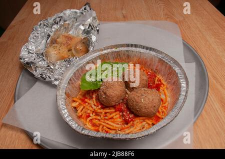 Heaping bowl full of delicious spaghetti and meatballs Stock Photo