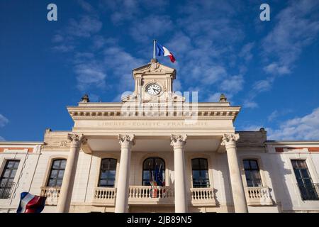 Picture of the facade of the arcachon city hall (Marie), with the french flag waiving and the slogan Liberte Egalite Fraternite. Liberté, égalité, fra Stock Photo
