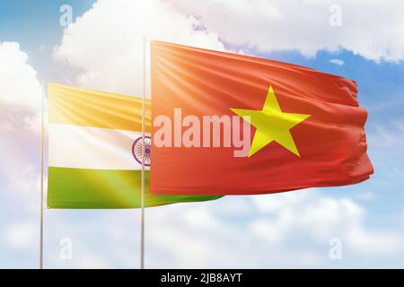 Sunny blue sky and flags of vietnam and india Stock Photo