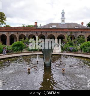 London, Greater London, England, May 28 2022: Fountain with the Orangery and tower behind at Holland Park in the Kensington area. Stock Photo