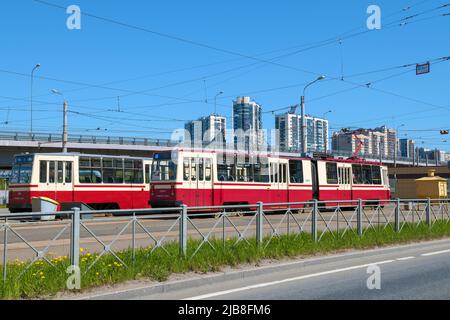 SAINT PETERSBURG, RUSSIA - MAY 22, 2022: Two city trams on the Lakhtinsky Razliv terminal station Stock Photo