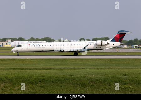 A Delta Connection (Endeavor Air) Bombardier CRJ-900LR landing at Montreal Pierre Elliott Trudeau International Airport. Endeavor Air is an American regional airline that operates as Delta Connection for Delta Air Lines. The airline was founded as Express Airlines I in 1985 and was renamed Pinnacle Airlines in 2002 Stock Photo