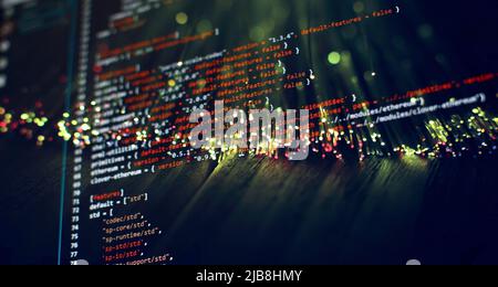 Security code on a computer display, close up. Database bits access stream visualisation. Php language and coding function developer Stock Photo