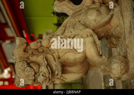 Statue guardian dog at Kanda shrine in Tokyo Stock Photo