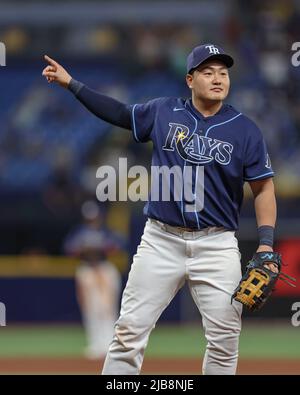 St. Petersburg, FL. USA;  Tampa Bay Rays first baseman Ji-Man Choi (26) teases and plays with some of the fans during a major league baseball game aga Stock Photo