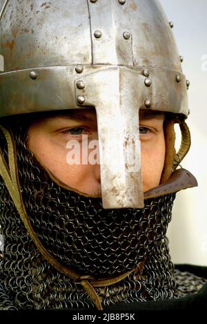 Knight face close-up with nasal helmet and chainmail on, symbol for virtue and chivalry Stock Photo