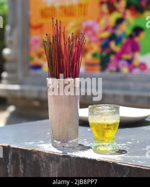 Senko candles smoldering in Vietnamese Buddhist temple Stock Photo