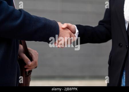 handshake between a man and a woman closing a deal Stock Photo