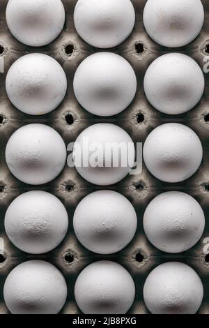 Organic eggs arranged in a green egg box Stock Photo