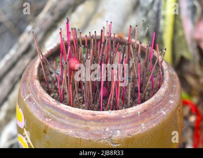 Senko candles smoldering in Vietnamese Buddhist temple Stock Photo