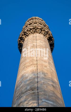 Close up of one of six minarets of Sultan Ahmed Mosque or Sultan Ahmet Camii, also known as the Blue Mosque with blue sky Stock Photo