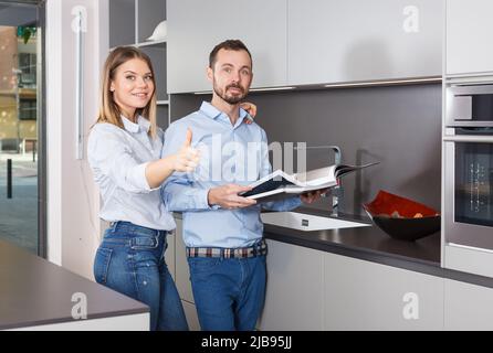 Loving couple with book Stock Photo