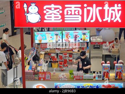 YANTAI, CHINA - JUNE 4, 2022 - People visit a MXBC store at a shopping mall in Yantai, East China's Shandong Province, June 4, 2022. On May 31, 2022, Stock Photo