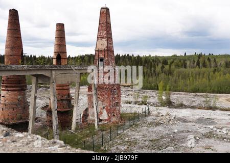 Lime kilns of an abandoned marble and lime factory on a cloudy day. Ruskeala, Karelia Stock Photo