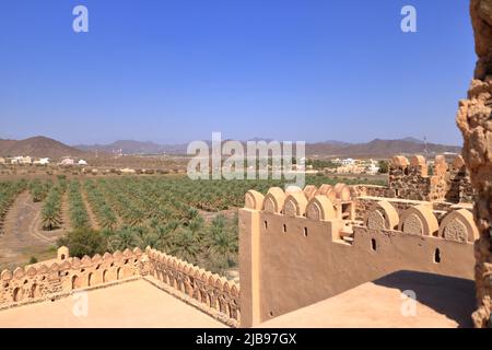 the Fort Jabreen Castle beautiful historic castle in Oman, with palm trees view Stock Photo