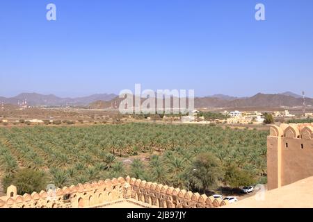 the Fort Jabreen Castle beautiful historic castle in Oman, with palm trees view Stock Photo