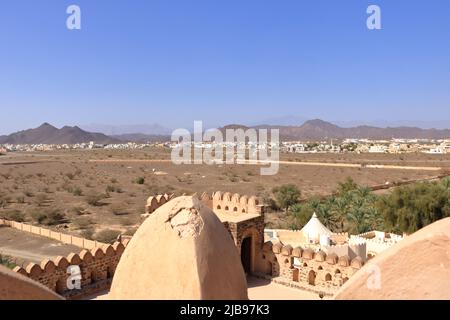 the Fort Jabreen Castle beautiful historic castle in Oman, with palm trees view Stock Photo