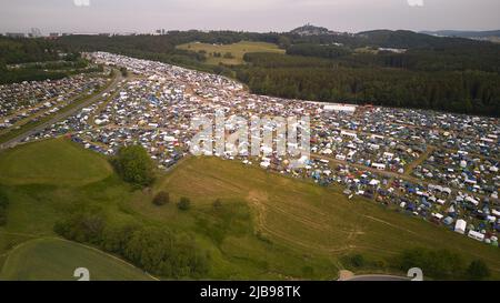 Nurburg, Germany. 04th June, 2022. 04 June 2022, Rhineland-Palatinate, Nürburg: Many festival-goers of the open-air rock festival 'Rock am Ring' camp out on huge camping areas around the Eifel race track (aerial view with a drone). The festival is sold out with 90,000 visitors. Photo: Thomas Frey/dpa Credit: dpa picture alliance/Alamy Live News Stock Photo