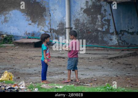 Kids playing in a ground near railway station Stock Photo