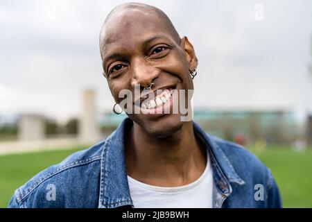 Happy African gay man celebrating pride festival - LGBTQ community concept Stock Photo