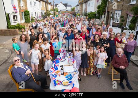 Twickenham, UK, June 03, 2022. Residents of Albert Road in Twickenham gather together with friensds and relatives to hold a street party In celebration of the Queens Platinum Jubilee – 70 years since Queen Elizabeth's accession to the throne in 1952 Credit: David Gee/Alamy Live News Stock Photo