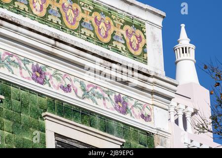 House with green ceramic tiles and azulejo frieze representing flowers in Lagos, Algarve, Portugal Stock Photo