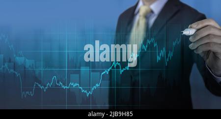 businessman drawing graph on virtual screen. economic recovery after crisis. Business analysis big data screen and economic growth with financial grap Stock Photo