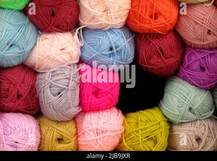 A Display of Brightly Coloured Knitting Wool Balls. Stock Photo