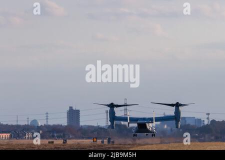 A  Bell Boeing V22 Osprey tilt-rotor aircraft with the US Marines takes off from Naval Air Facility Atsugi in Yamato, Kanagawa, Japan. The Osprey is a controversial transport aircraft. With a patchy safety record, it is often the focus of anti-US base and forces in Japan, especially Okinawa. It is a rare visitor to this Atsugi Base. Stock Photo