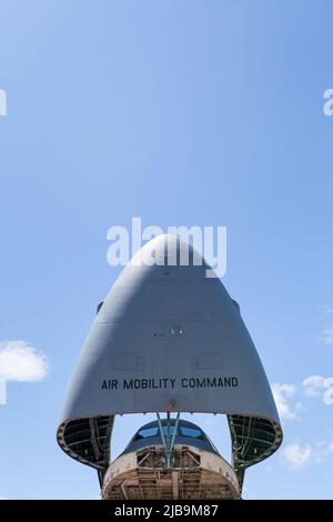 The nose cone of a Lockheed Martin C-5M Super Galaxy with the 312th Airlift Squadron of the United States Air Force reserve lifted above the cockpit at Yokota Airbase, Fussa. Stock Photo