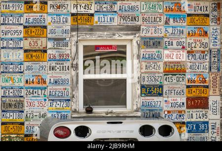 car license plates from different states and a corvette car rear end ...