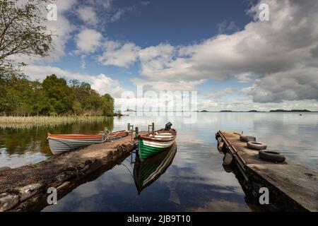 Small boats moored at Lough Corrib, County Galway, Ireland Stock Photo