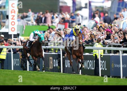 Desert Crown ridden by jockey Richard Kingscote (right) wins the Cazoo Derby (In Memory of Lester Piggott) race on Derby Day during the Cazoo Derby Festival 2022 at Epsom Racecourse, Surrey. Picture date: Saturday June 4, 2022. Stock Photo