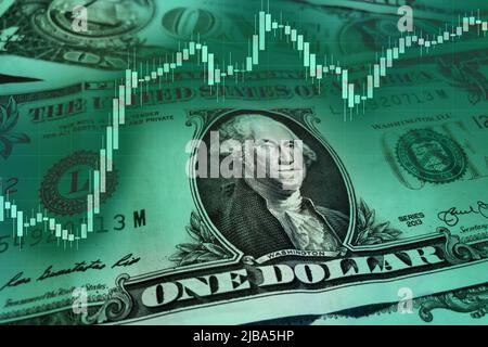 US dollar with a stock market index chart. Dollar rise concept. Economic recovery of the United States of America. US economic and financial recovery. Stock Photo